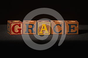 Wooden blocks spelling out the word grace