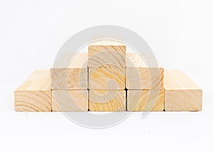 Wooden blocks stacked in the shape of a pyramid. Empty space for text, concept or business templates