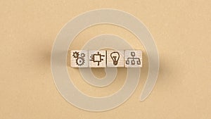 Wooden blocks with technology and idea icons