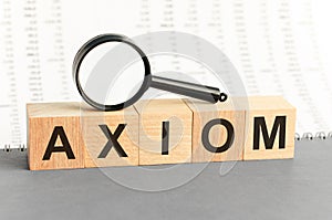 Wooden Blocks with the text: axiom with magnifying glass
