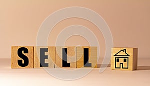 Wooden blocks with Sell and House photo
