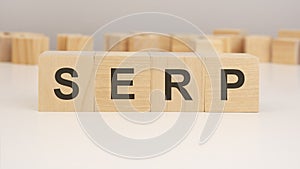 wooden blocks with text SERP on wood white table