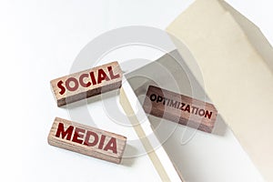 Wooden blocks with text SMO social media optimization in a box on a white background photo