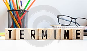 Wooden blocks with the text: TERMINE. The text is written in black letters photo