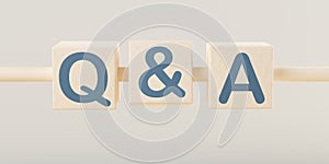 Wooden blocks on wood stick with the letters q&a on grey wall background, question and answer business concept, selective focus