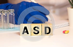 Wooden blocks with the word ASD - Autism Spectrum Disorder. Neurological and developmental disorder