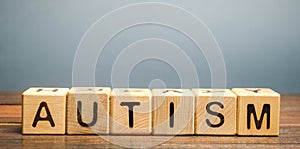 Wooden blocks with the word Autism. Neurological and developmental disorder. ASD