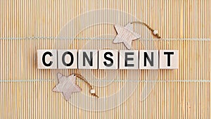 Wooden blocks with the word CONSENT