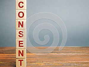 Wooden blocks with the word Consent. Acceptance, agreement and comprehension concept. Business contract and deal. Convention