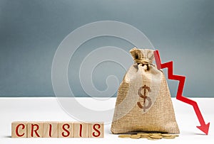 Wooden blocks with the word Crisis and money bag. The concept of financial and economic crisis. capital outflow. sabotage of the