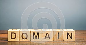 Wooden blocks with the word Domain. Internet address / name of the site, consisting of a set of characters and numbers