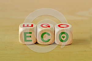 Wooden blocks with the word Eco and Ego - Concept of ecology and environmental conservation