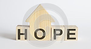 Wooden blocks with the word HOPE , house. The concept of the high cost of rent for an apartment or home photo