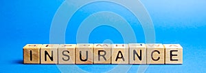 Wooden blocks with the word Insurance. Life insurance, health, business, property. Protection and Security Concept