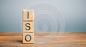 Wooden blocks with the word ISO. International organization for standardization. Quality standard