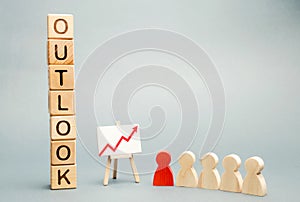 Wooden blocks with the word Outlook, business schedule and a team with a leader. Successful forecast and successful business.