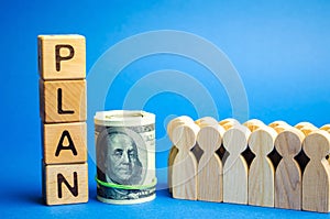 Wooden blocks with the word Plan and a business team standing next to money. Strategy planning. Management business concept.