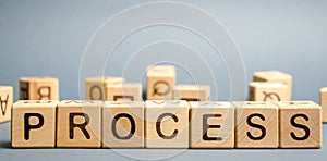 Wooden blocks with the word Process. Business management concept. Litigation and technological processes photo