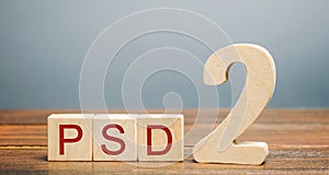 Wooden blocks with the word PSD 2 - Payment Services Directive. European Commission Banking Directive. Increase payment efficiency