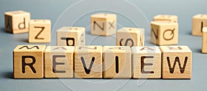 Wooden blocks with the word Review. Customer review concept. Reviewing, auditing, reviewer. Service rating. Feedback