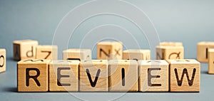Wooden blocks with the word Review. Customer review concept. Reviewing, auditing, reviewer. Service rating. Feedback
