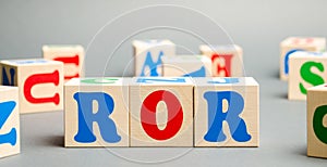 Wooden blocks with the word ROR. Ratio between the net profit and cost of investment resulting from an investment of resources.