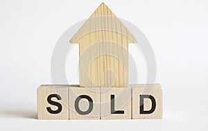 Wooden blocks with the word SOLD , house. Real estate market