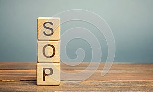 Wooden blocks with the word SOP  Standard operating procedure . Instructions to assist employees in complex routine operations. photo