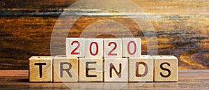 Wooden blocks with the word Trends 2020. Main trend of changing something. Popular and relevant topics. New ideological trends of