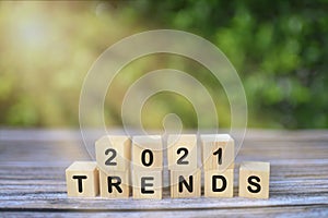 Wooden blocks with the word Trends 2021. Main trend of changing something. Popular and relevant topics.
