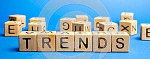 Wooden blocks with the word Trends. Popular and relevant topics. New ideological trends. Recent and latest trend