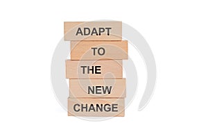 Wooden blocks with words Adapt to the new change on white background