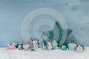 Wooden blue or mint green christmas background with decoration.