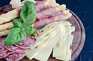 Wooden board with appetizers