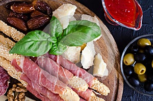 Wooden board with appetizers