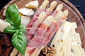 Wooden board with appetizers