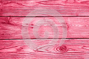 wooden board background. aged weathered red pink purple timber wood planks. toned in viva magenta