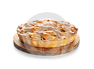 Wooden board with delicious apple pie on white background