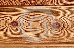 Wooden board with distinctive grain and two gnarls