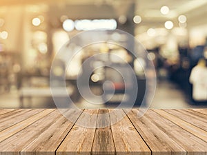 Wooden board empty table blurred background. Perspective brown w