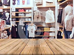 Wooden board empty table blurred background. Perspective brown wood over blur in department store.