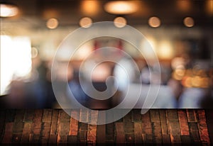 Wooden board empty table cafe, coffee shop, bar blurred backgro