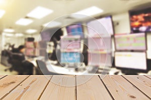 Wooden board empty table in front of blurred background of Blurring man operated plant