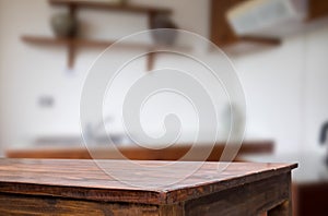 Wooden board empty table in front of blurred background. Perspective brown wood over blur in coffee shop - can be used for