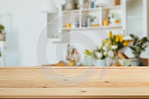 Wooden board empty table in front of a blurred background. Perspective brown wood with a blurred background of the kitchen and
