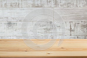 Wooden board empty table in front of a blurred background. Perspective brown wood with blurry grunge or old wall backdrop - can be