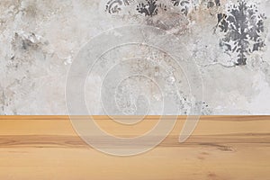 Wooden board empty table in front of a blurred background. Perspective brown wood with blurry grunge or old wall backdrop - can be