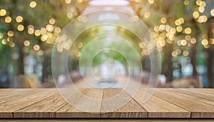 Wooden board empty table in front of blurred background. Perspective brown wood over blur in coffee shop - can be used for display