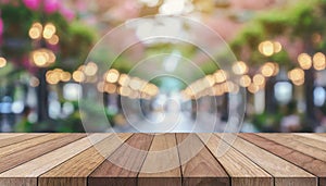 Wooden board empty table in front of blurred background. Perspective brown wood over blur in coffee shop - can be used for display