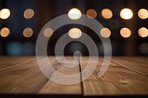 Wooden board empty table in front of blurred lighting background.